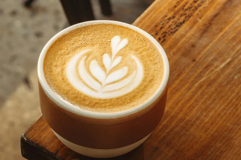 Latte art on rustic table